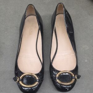 Prada Glossy Black Flats with Gold Detail